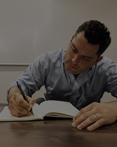 Brad writing in journal